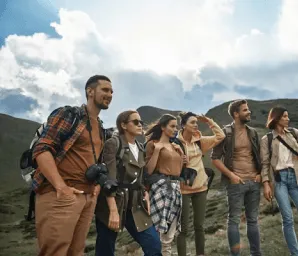 Group of hikers standing together on a mountain ridge